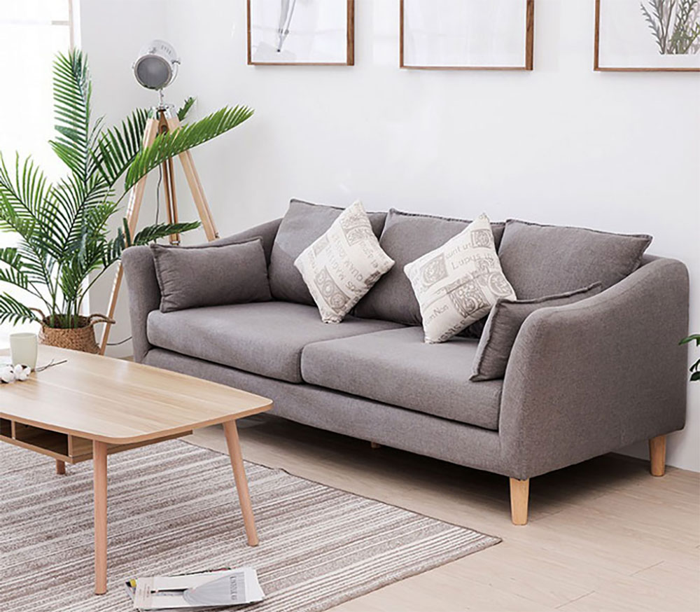 Sofa văng bọc vải màu xám kết hợp gối màu be có họa tiết
